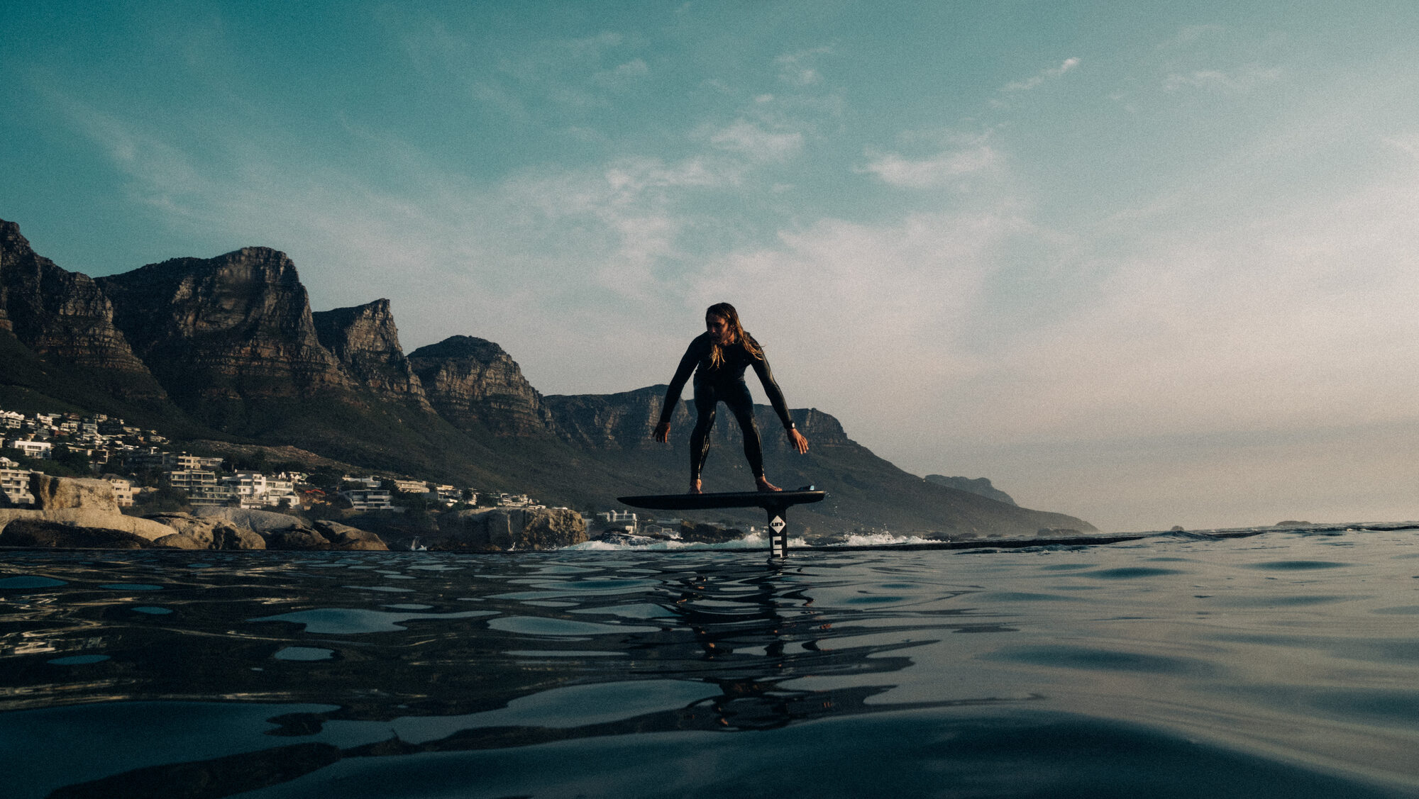 A coastal portrait story in Camps Bay with waterline atmosphere and golden Cape light.